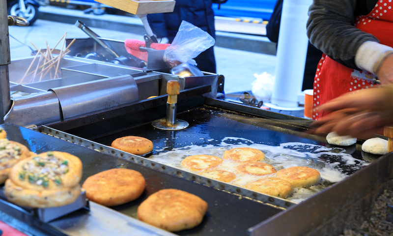 hotteok, a small, stuffed pancake with a sugary filling.